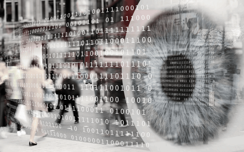 Blurred figure walking past cascading binary code overlay, representing surveillance concerns and data collection in AI-powered workplace
